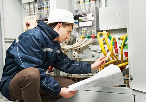 industrial electrician working on commercial wiring